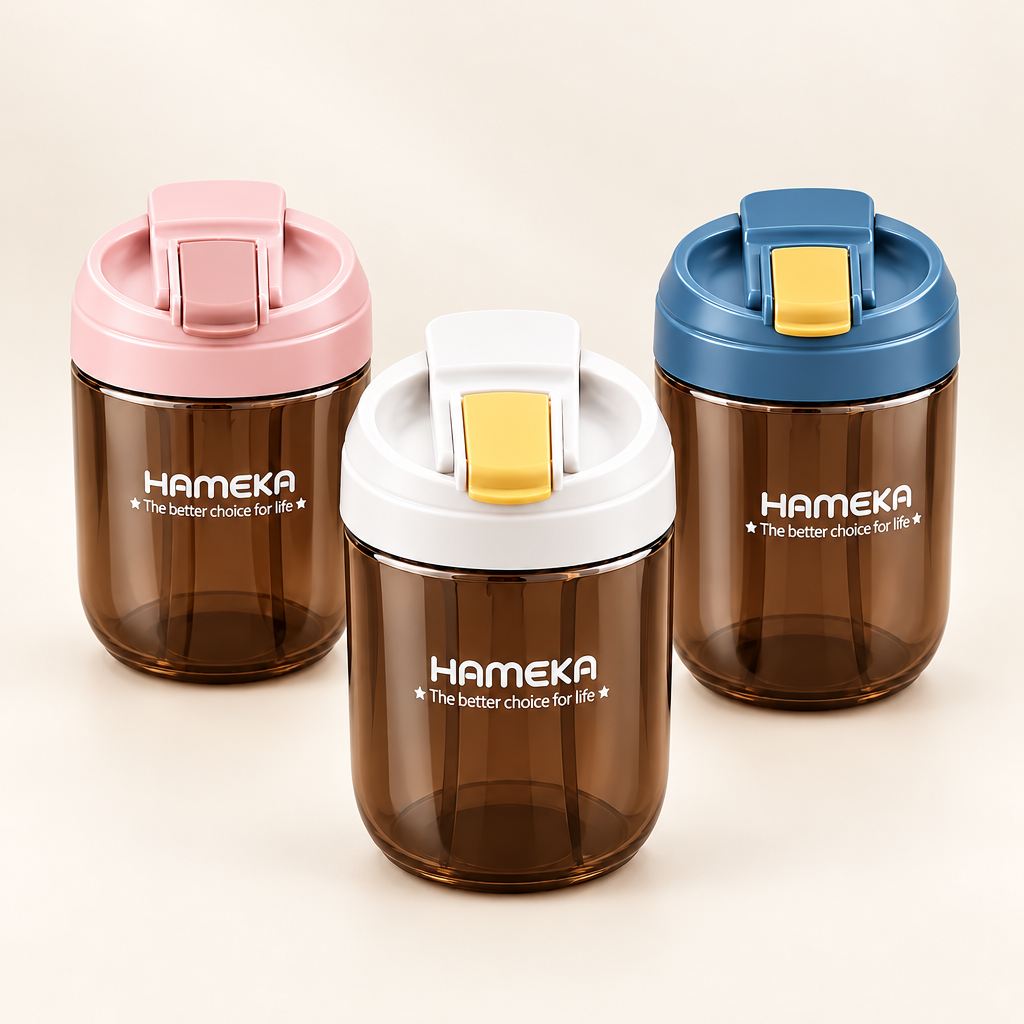 Three HAMEKA travel water bottles with flip-top lids in pink, white, and blue, made of translucent dark brown plastic, arranged on a beige background.