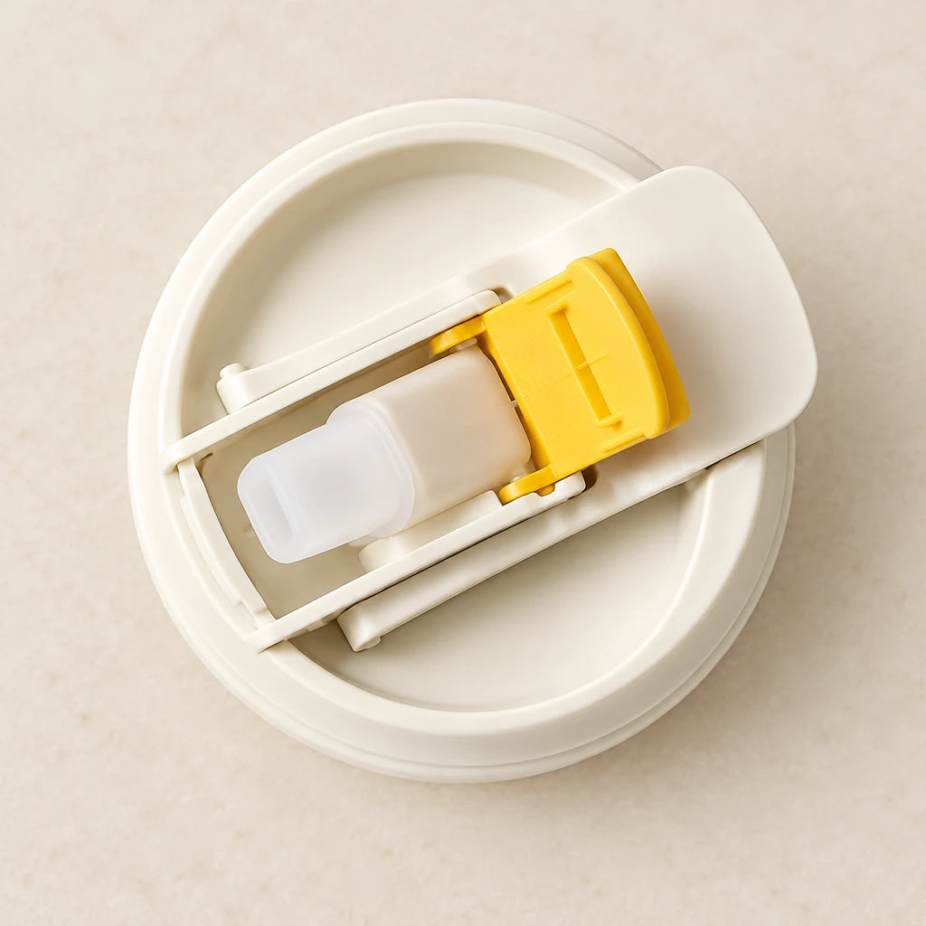 Children's sippy cup with safety soft silicone straw on a book