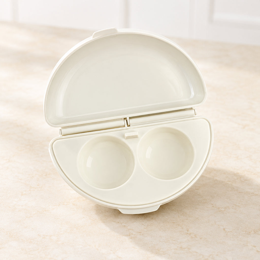 Egg cooker with two compartments on a white background