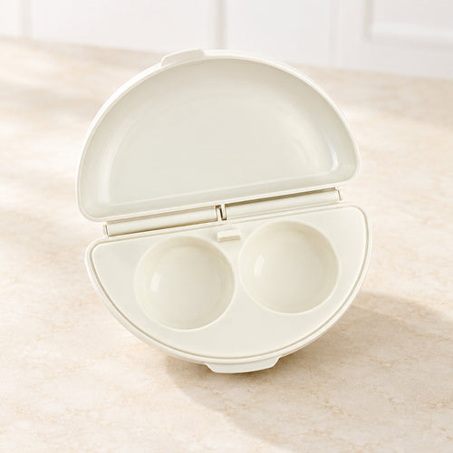 Egg cooker with two compartments on a white background