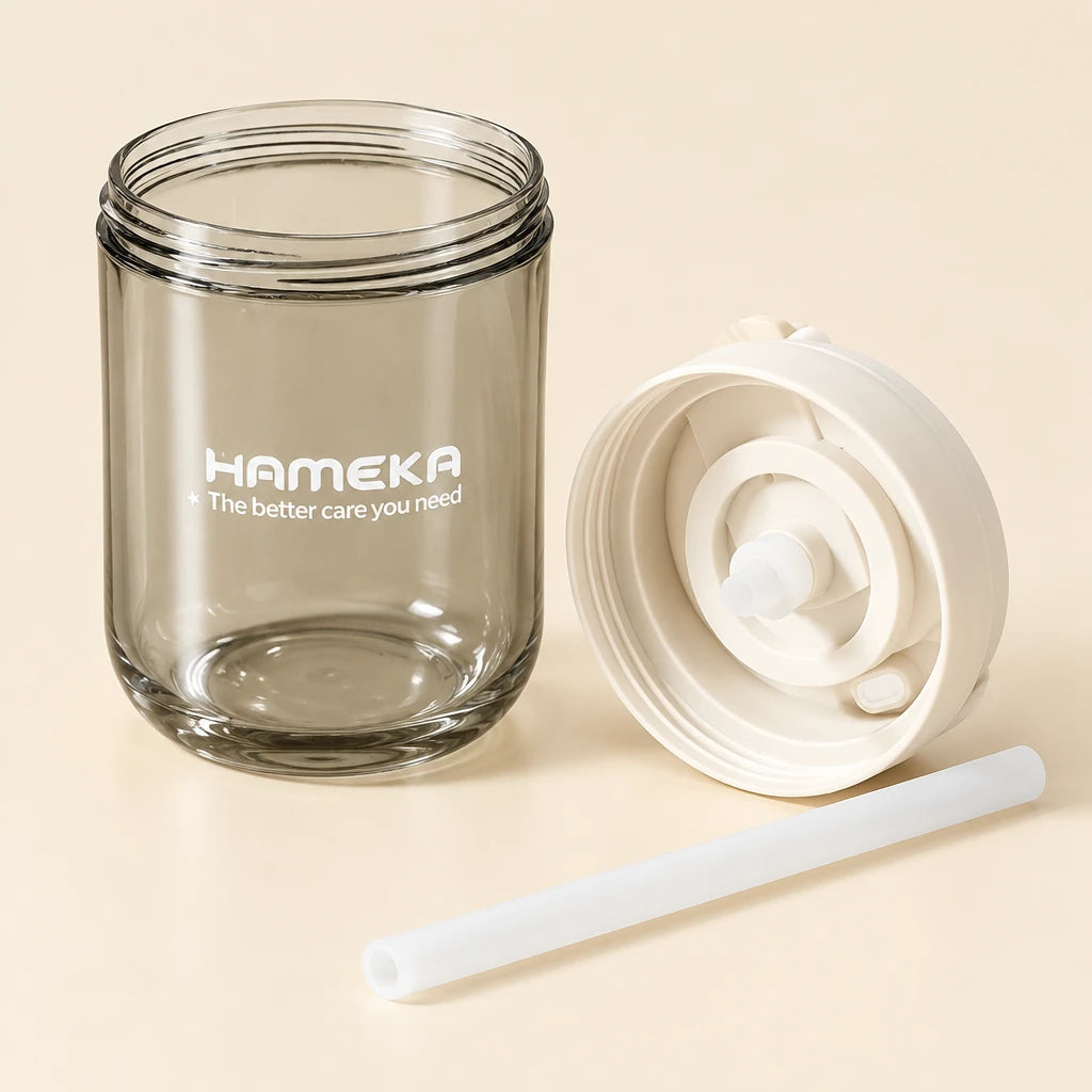 Clear jar with white lid and straw on a book, with 'Fameka' branding.